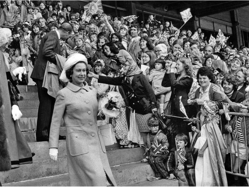 Cheering crowds greet the Royal couple at Doncaster Racecourse in 1977.
