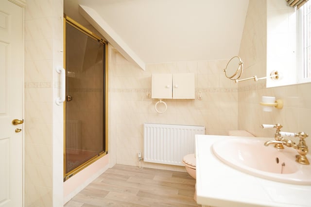 There are two bathrooms on the upper floor, including the principal bedroom's ensuite.