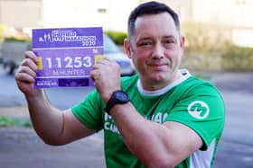 Michael Hunter is taking part in eight challenges this year to raise funds for Macmillan Cancer Support. Here he is holding one of his old race numbers. Pictures by Brian Eyre.