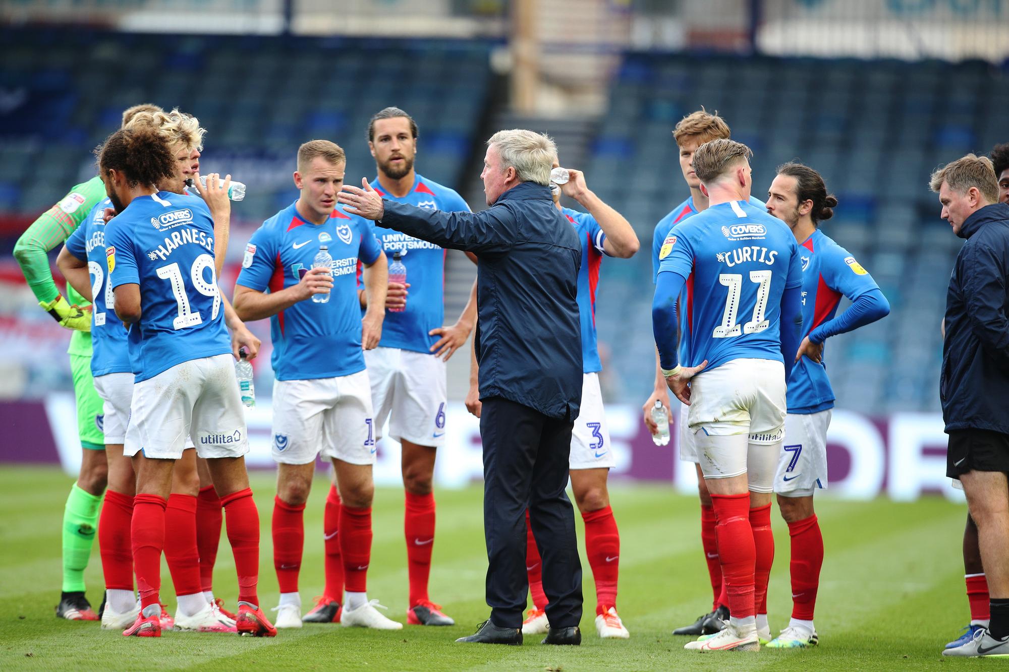 Pompey manager Kenny Jackett talks to his players