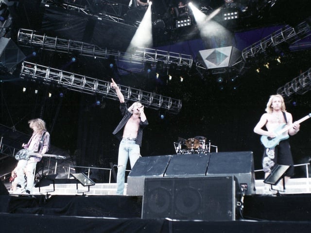 Born on November 1, 1963, Rick Allen attended Dronfield Henry Fanshawe School and began playing drums at age nine before later joining Def Leppard in 1978. He overcame the amputation of his left arm seven years later and continues to play with the band to this day. The band are pictured here playing at Don Valley, Sheffield in 1993.