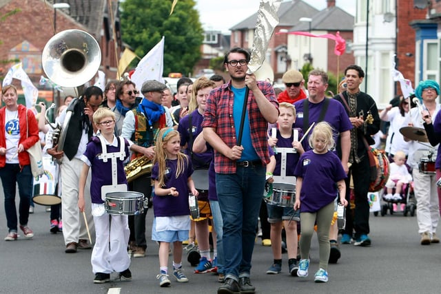 Artistic Director Ross Millard leads the Summer Streets Music Festival parade towards Thompson Park. Were you a part of the festival five years ago?
