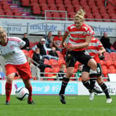 Doncaster Belles' Millie Bright has a shot on goal against Liverpool in 2012