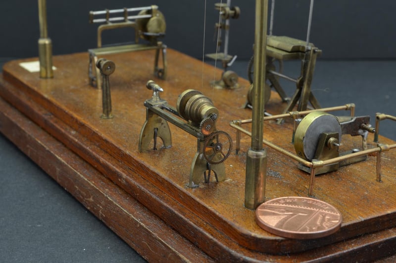 The world's smallest engine was made by Matlock-based watchmaker RB Cobb and exhibited at the Chicago World Fair in 1933-34. The belt is made of a human hair.