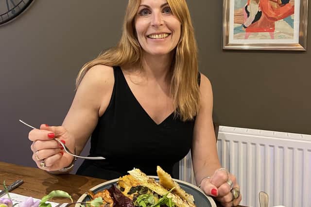Rowan Adlington eating in Figaro, the café that she has opened in Wingerworth.