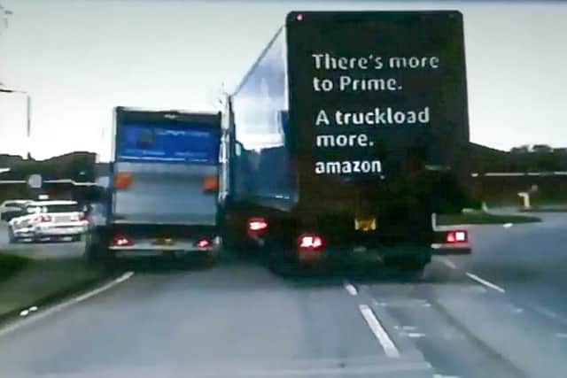 Dashcam footage shows Adrian Kowalski's truck being forced off the road by the Amazon vehicle at a roundabout just off the M1 in Barlborough, Derbyshire. (Picture: Richard Madin / SWNS)