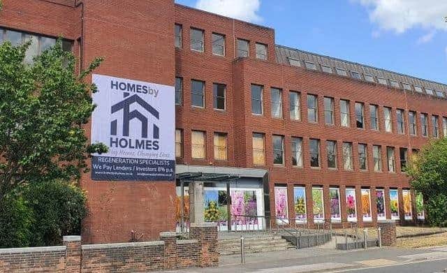 In recent weeks, Homes by Holmes has taken steps to make the building on Saltergate, Chesterfield, look more attractive, including by installing colourful banners in the windows to celebrate the Chesterfield in Bloom competition.