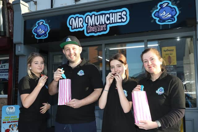 Bradley Mower, with his wife Rebecca and daughters Lillie and Chloe, outside Mr Munchies Candy Store in Kirkby.