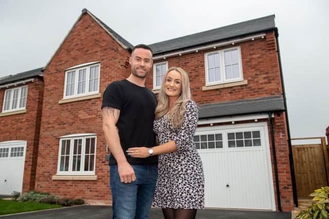 Faye and Rob outside their new house at the Ashberry Homes Cherry Meadow development
