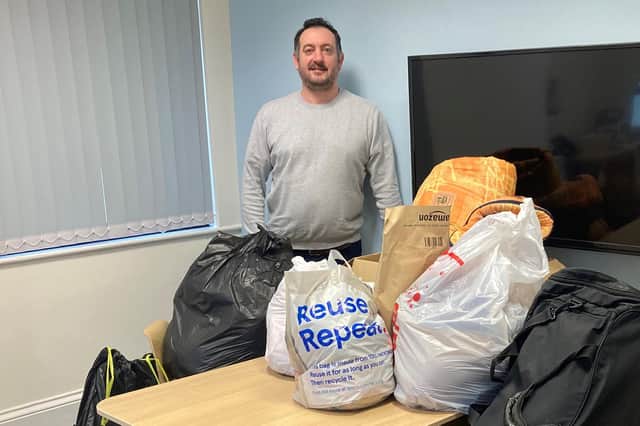 Belmayne partner, Jon Stevens, with the items collected for Pathways of Chesterfield.