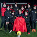 SGB-24411 Harron Homes Sales Manager Paul Walters alongside the Carr Vale U10s team in their new kit