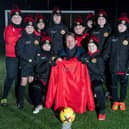 SGB-24411 Harron Homes Sales Manager Paul Walters alongside the Carr Vale U10s team in their new kit