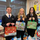 Murray Park Year 11 pupils Peyton Giles, Sophie Arnold and Erin MacPhail with the food parcels ready