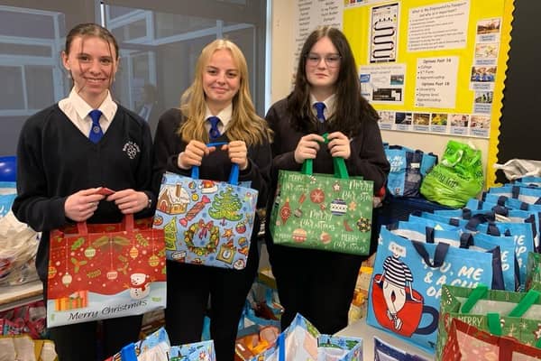 Murray Park Year 11 pupils Peyton Giles, Sophie Arnold and Erin MacPhail with the food parcels ready