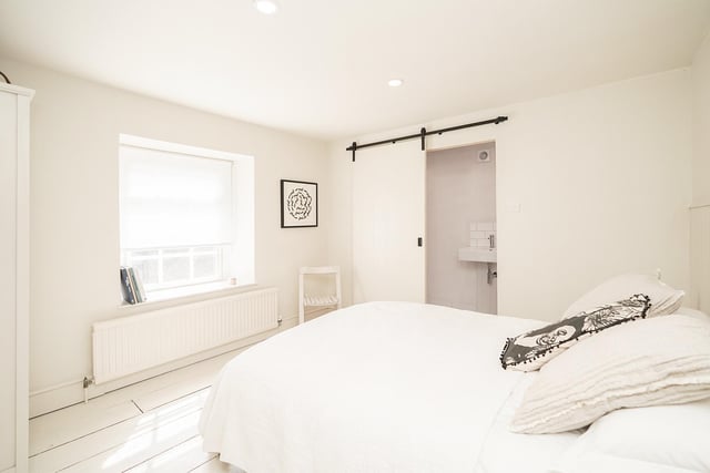 One of the bedrooms has a newly fitted en suite while the principal bedroom has an adjoining bathroom.