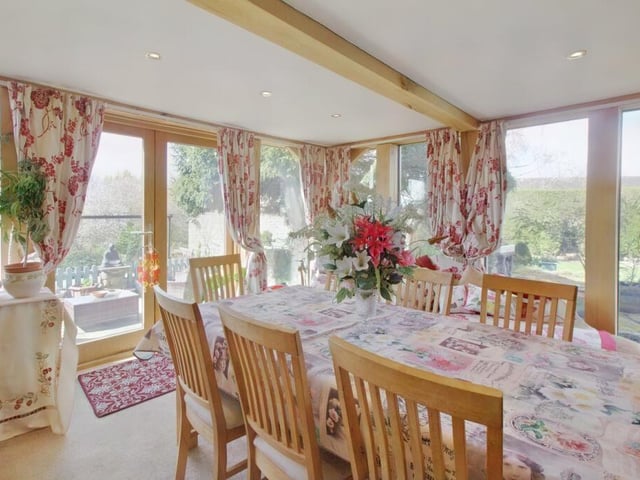 With French doors opening on to the patio, this full-height room has ample space for a range of furniture.