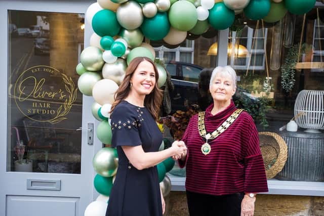 Claire Fenner and Belper mayor Cllr Katie Harris outside Oliver's Hair Studio in Belper, which opens for business this week. Photo: Kristen Duffy.