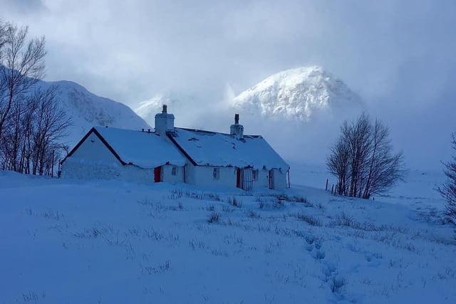 This picture of a country cottage weighed down by snow, taken by Dave Allison, could easily grace a Christmas card.