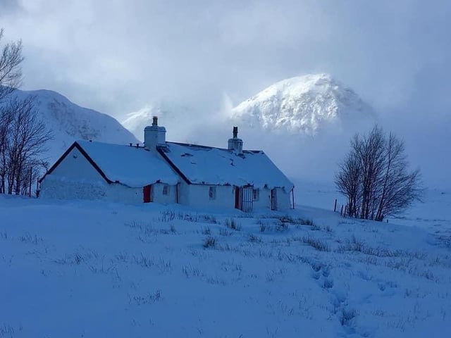 This picture of a country cottage weighed down by snow, taken by Dave Allison, could easily grace a Christmas card.