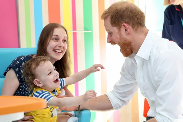 The Duke of Sussex, Prince Harry, is shown playing with one-year-old Noah Nicholson during his visit to Sheffield Children's Hospital in 2019.
