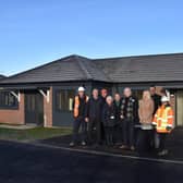 Council and Dragonfly Development officials outside the new bungalows on Market Close