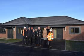 Council and Dragonfly Development officials outside the new bungalows on Market Close