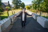 Helene Ball with the concrete blocks placed outside the property blocking vehicle access