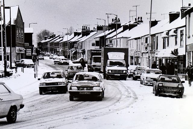 This shot shows cars fightin through the snow on Chatsworth Road in 1986
