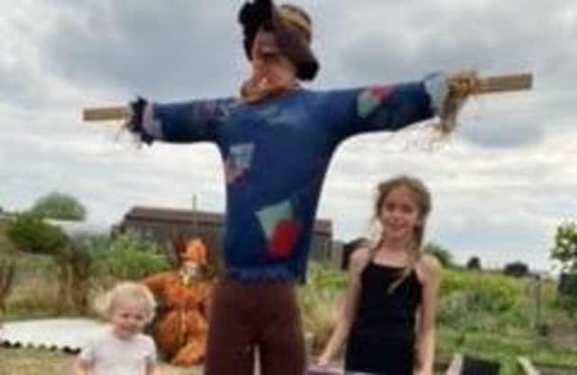 Darcie Mae Stanhope, 9, won the junior scarecrow competition and is pictured with her handiwork.