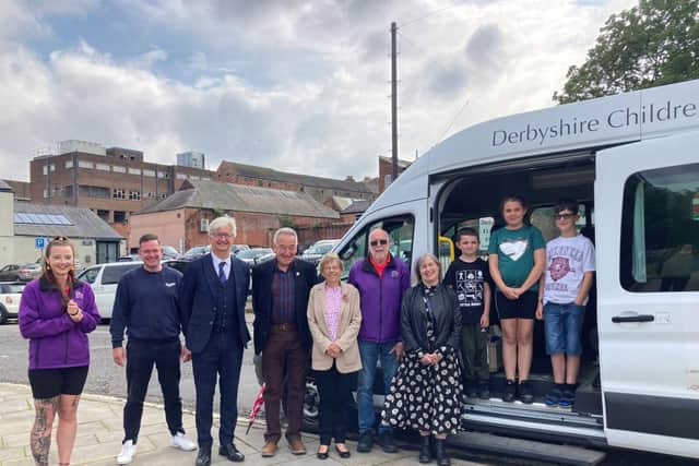 Children returning from holiday with representatives from Rotheras and the charity