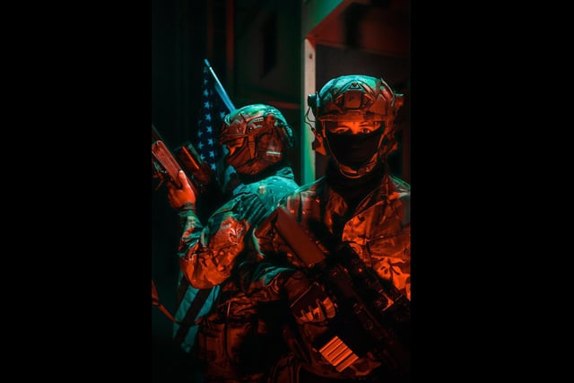 Two Royal Marines from 40 Commando Recce Troop poses for a photograph whilst on a military training exercise in California. The Royal Marines were practicing urban operations acting as an enemy force against USMC forces. This image was part of the winning selection by Amateur Photographer of the Year, Marine James Clarke.