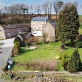 The farmhouse, outbuildings and 15 acres of land at Alice Head Road, Ashover, are on sale for £1.45million.