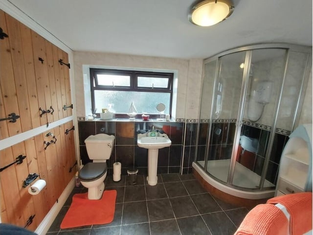 The first-floor bathroom has a large corner bath and separate shower cubicle.