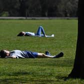 The warm Easter weather saw people tempted to the county's parks to sunbathe. Photo: Ben Stansall/Getty Images