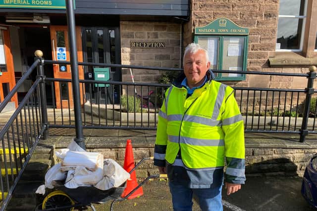 Matlock Mayor Cllr Steve Wain, the town's flood warden, helping with the clean-up process in the aftermath of the flooding