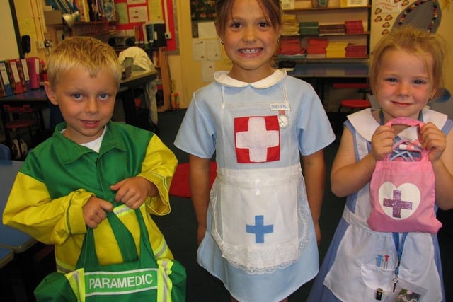 Jacob Walker, Amelia Mills and Chloe James in health workers' fancy dress at Newbold School in 2007.