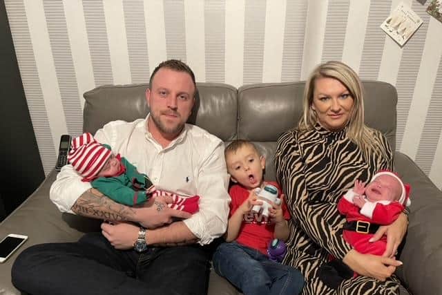 Michelle and her husband Andy pictured with their four-year-old son Reggie (centre) and twins, Charley and Tommy, during their first Christmas together shortly before they returned to hospital