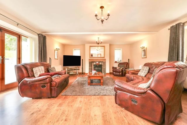 The living room is quite large and provides access to the rear garden.