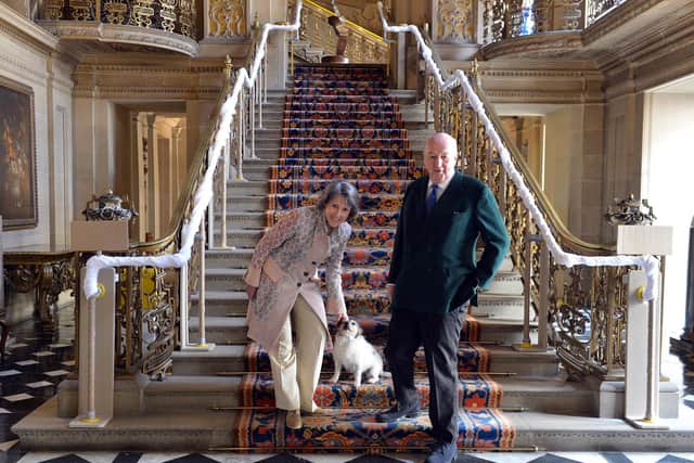 The Duke and Duchess of Devonshire in the painted hall at Chatsworth House.