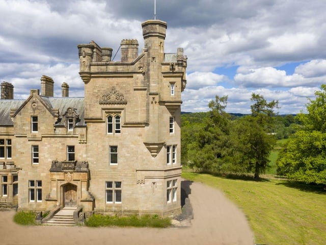 Residents can enjoy access to private grounds featuring a tennis court and extensive lawns and walks.