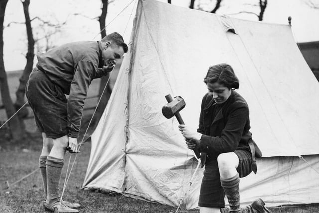 Two holidaymakers set up camp for the Easter Holidays at Glossop on 10th April 1936. (Photo by Fox Photos/Hulton Archive/Getty Images)