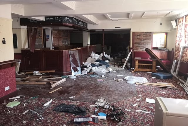 Images show a bar area covered in rubbish from the time the pub closed.