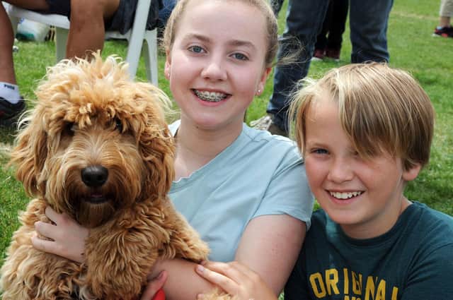 Alex Ewin, 11, and his sister, Sophie, 14, with cockerpoo Jasper, at a fun dog show organised by the RSPCA Chesterfield and North Derbyshire branch.