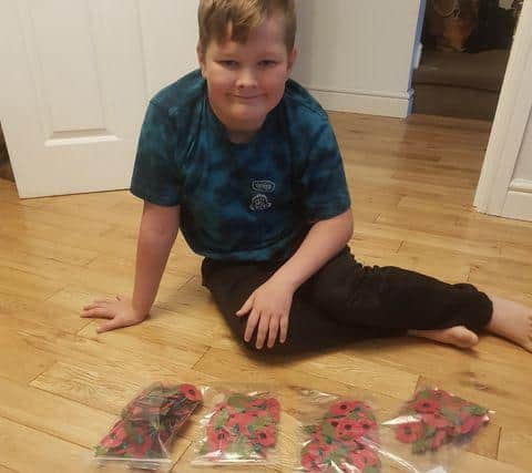 Ryan Rason, nine, has been busy selling poppies for the Royal British Legion.