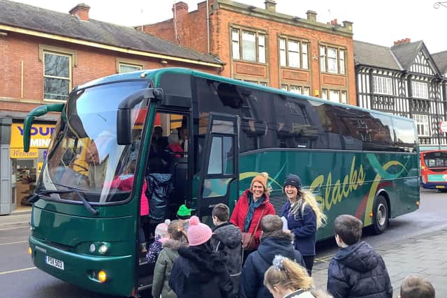 Staff and pupils from Hady Primary School received a free Christmas chauffeur service to travel through Storm Pia. (Photo: Contributed)