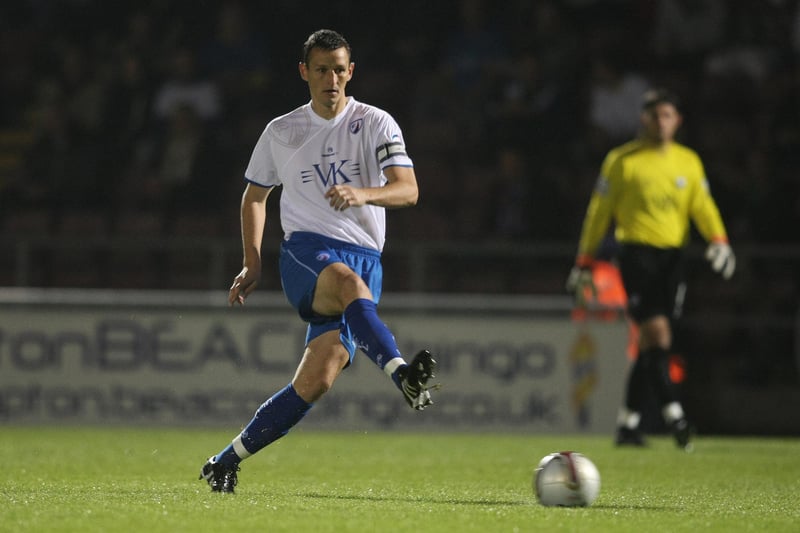 Ian Breckin passes the ball against Northampton Town. The central defender, who is now head coach at Wickersley Wanderers, played 212 times for Spireites between 1997 and 2002, before returning for a second spell in 2009.