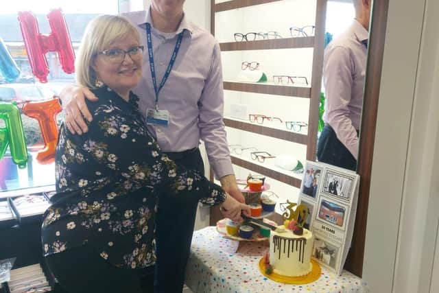 Oakwood Eyecare Directors, Tom and Liz, cutting the cake