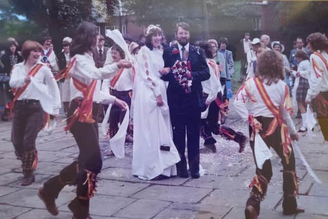 Shirley and Paul Niblock on their wedding day at Chesterfield's Crooked Spire Church in 1981. Holywell Cross Women's Morris, which Shirley co-founded, dance around the happy couple.