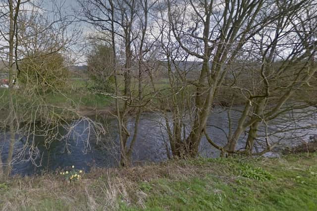 Plans for a watersports company to build its headquarters next to the banks of the River Derwent have been approved despite an ongoing legal battle with an angling club.