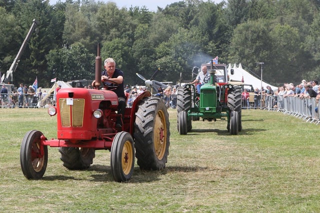 Crowds watched the tractor parade.